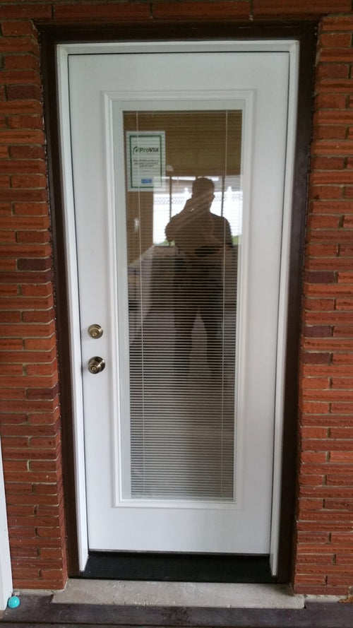 StrongJamb-reinforced white entry door with double deadbolt on a rental home